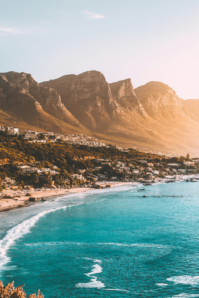 Mountains and turquoise coastline showcasing the coastal scenery of South Africa.
