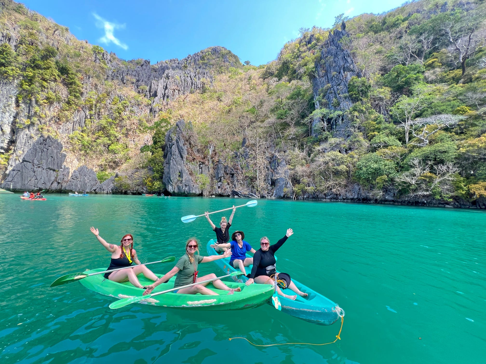 Damesly travelers kayaking in the Philippines